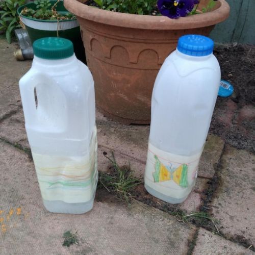 milk bottle watering cans.jpg